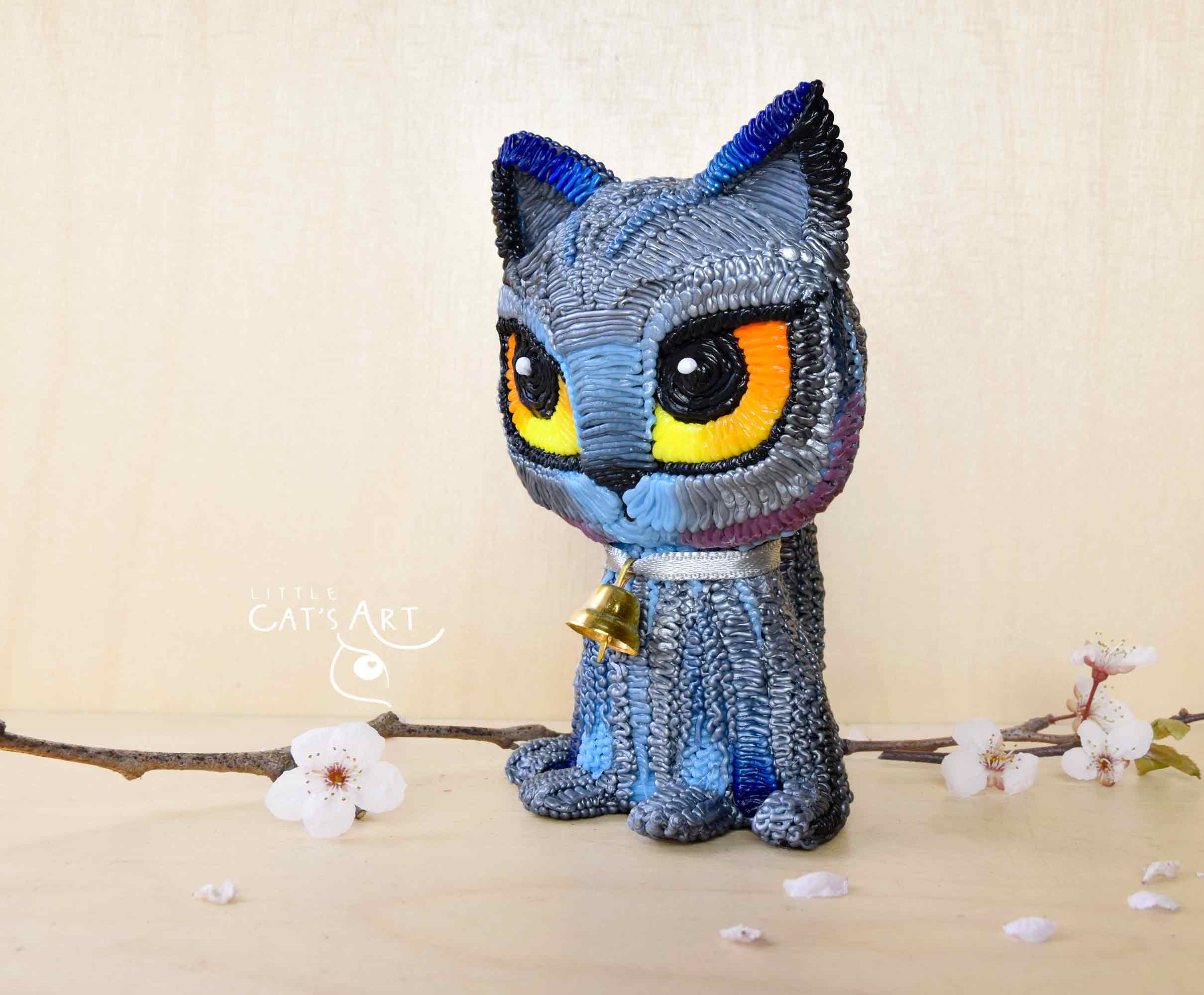 British Shorthair cat figure with mini golden bell necklace