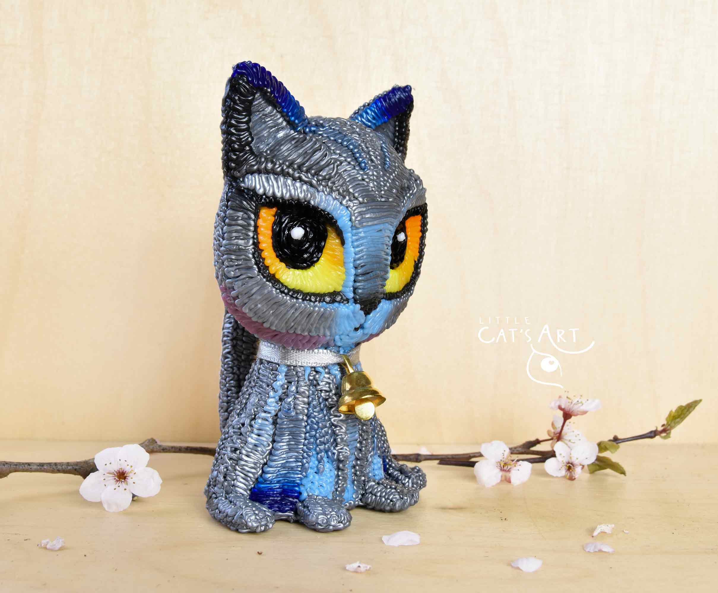 British Shorthair cat figure with mini golden bell necklace