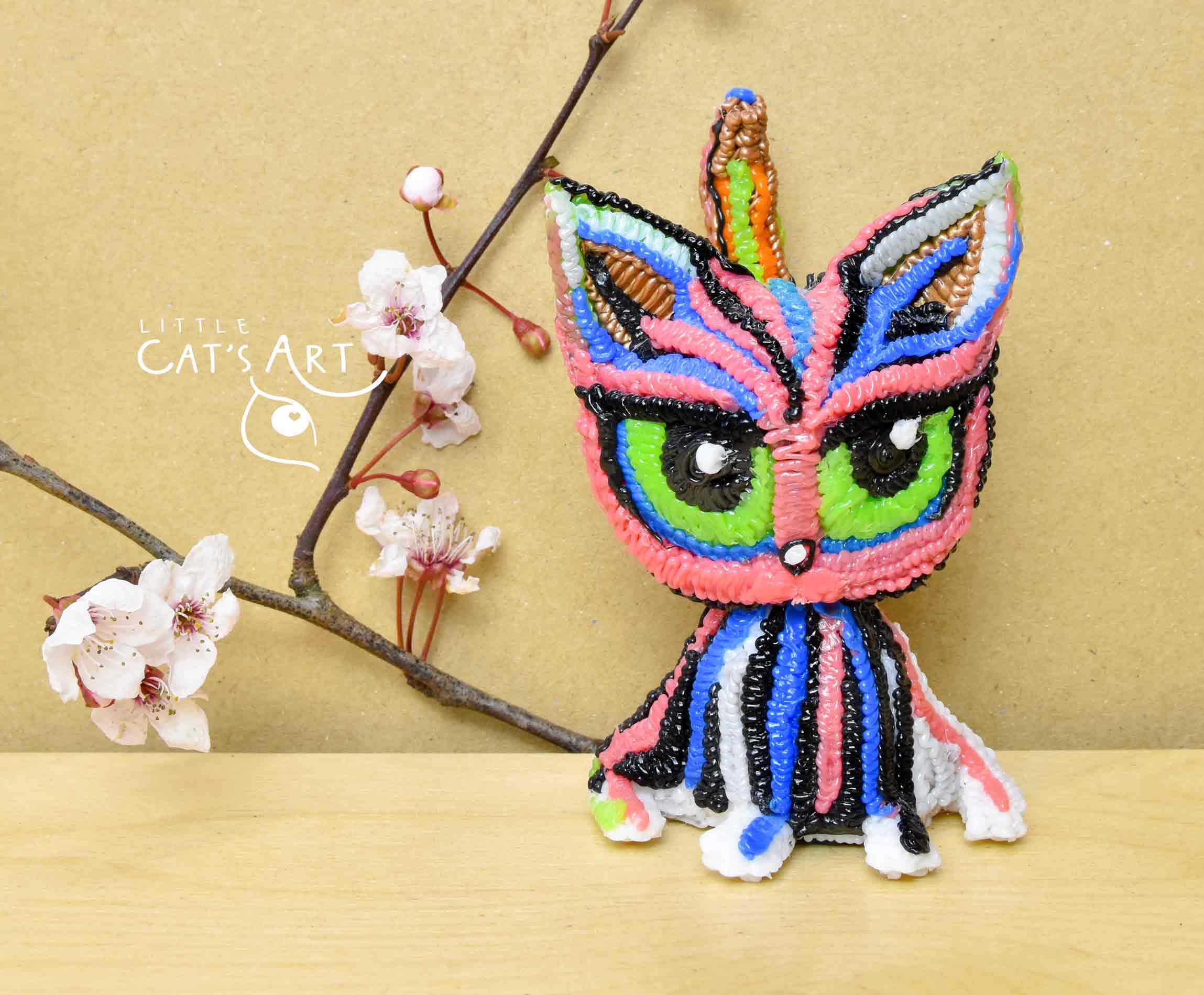 Vertical striped multicolour cat figurine