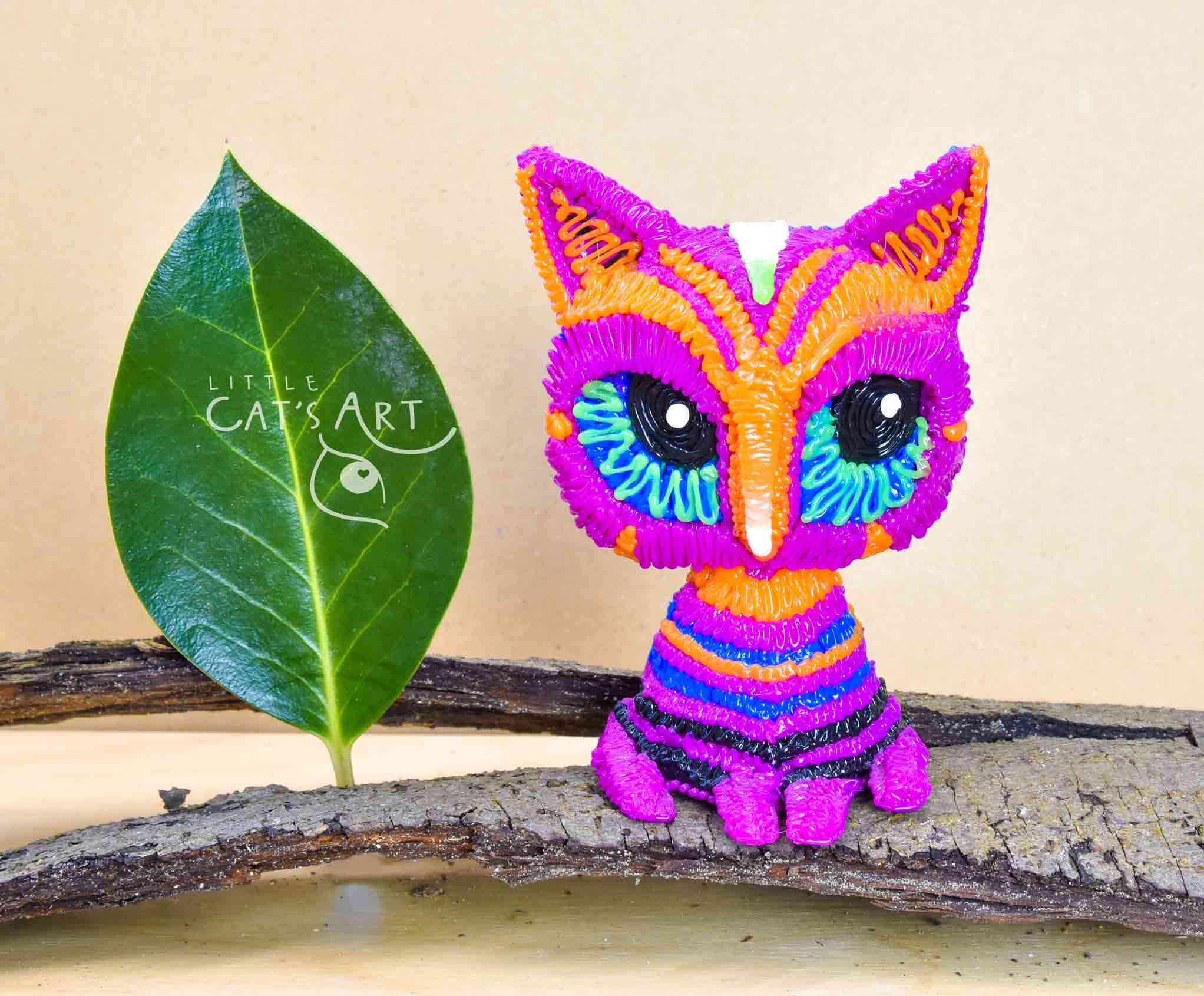 Multicolour pink striped cat figure