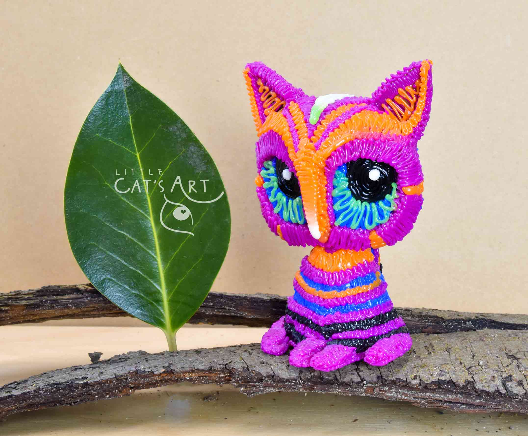 Multicolour pink striped cat figure