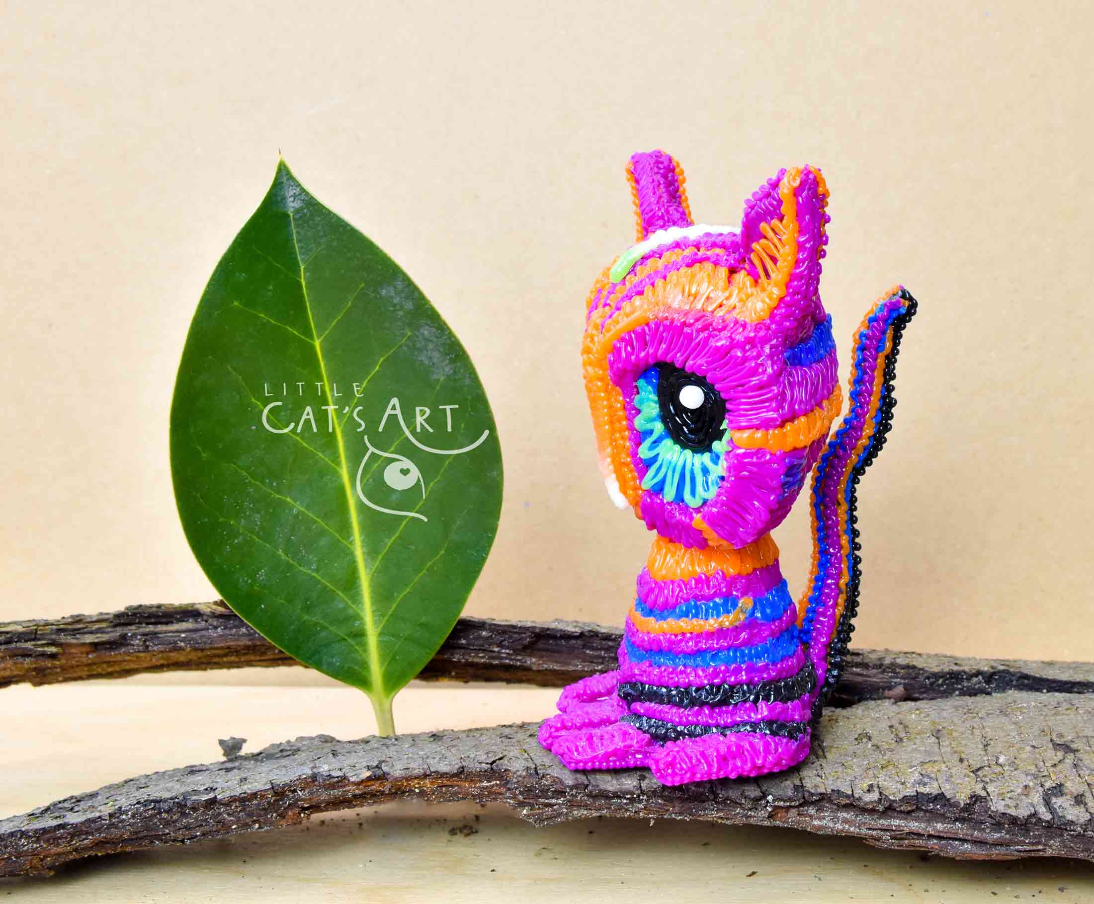 Multicolour pink striped cat figure