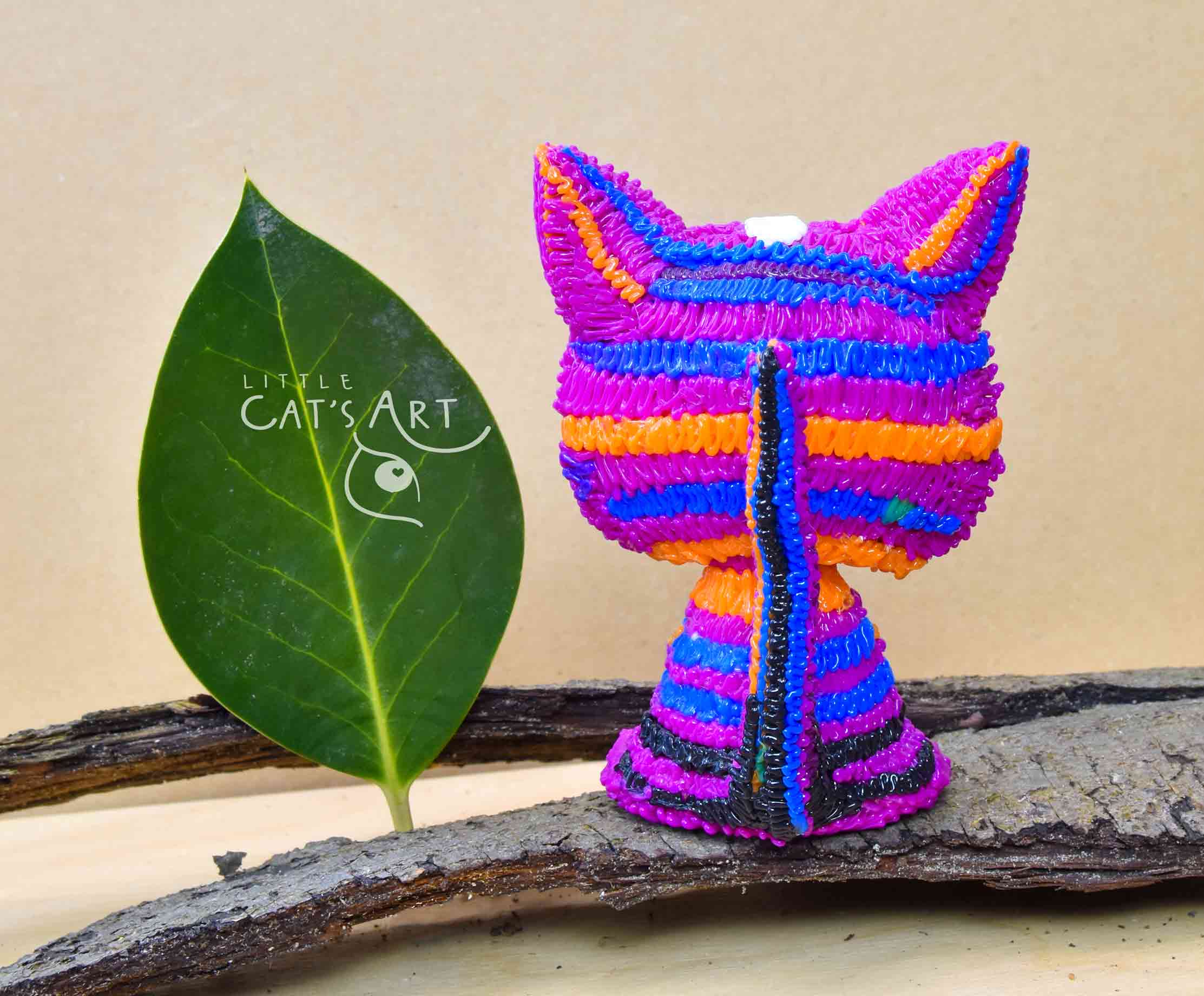 Multicolour pink striped cat figure