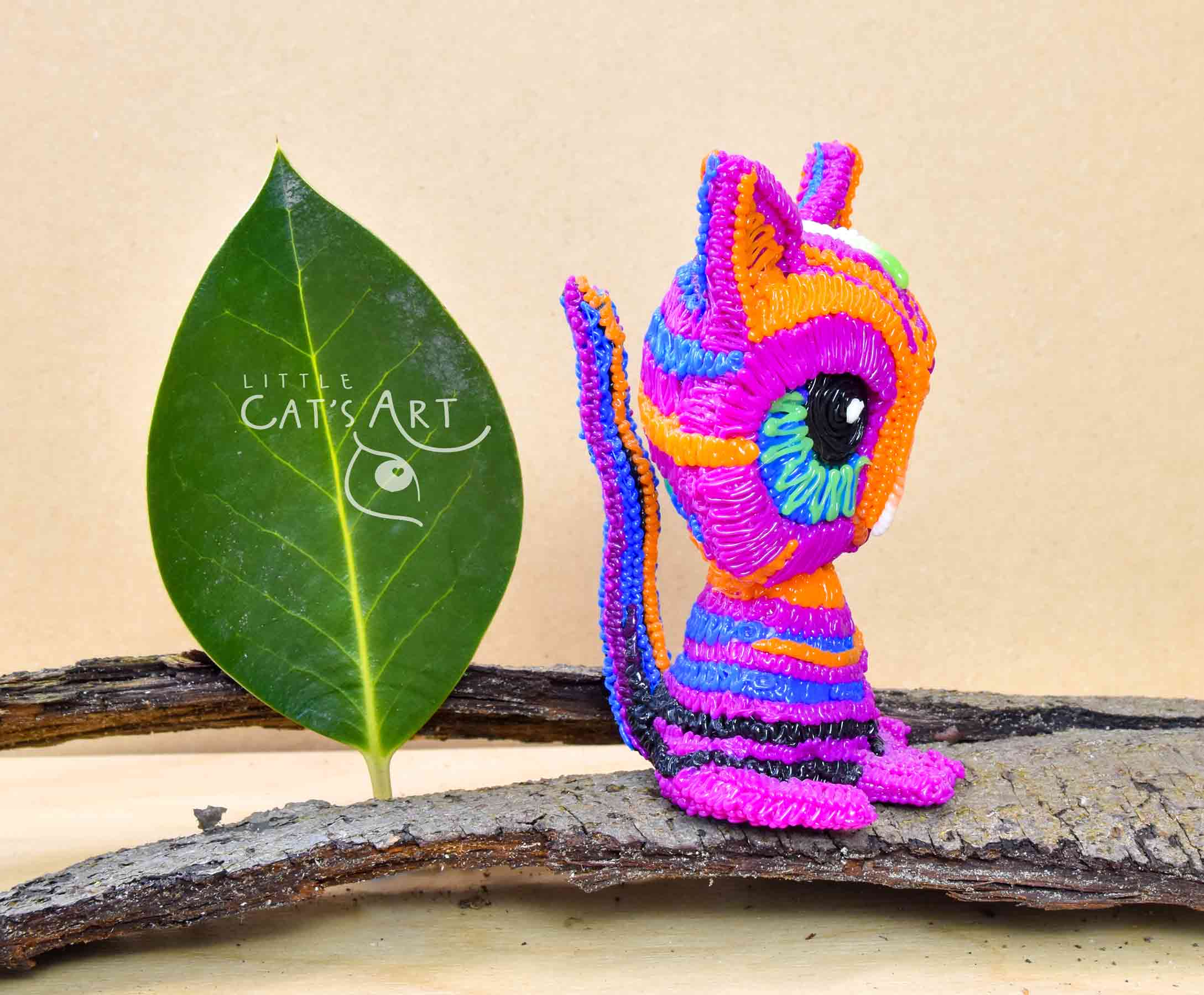 Multicolour pink striped cat figure