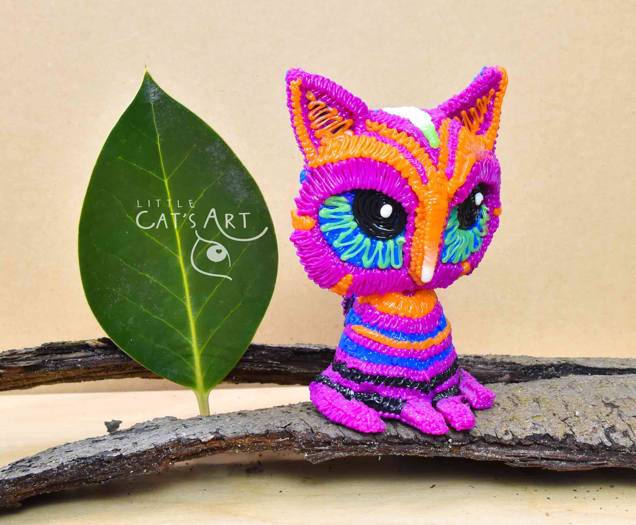 Multicolour pink striped cat figure