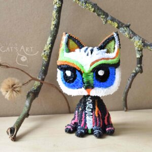 Multicoloured cat cheeky face figurine