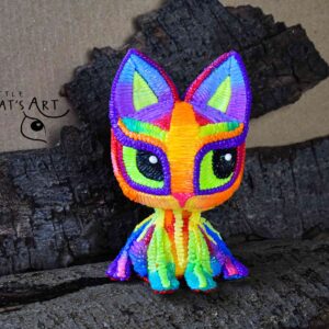 Rainbow cat figurine with bright green eyes