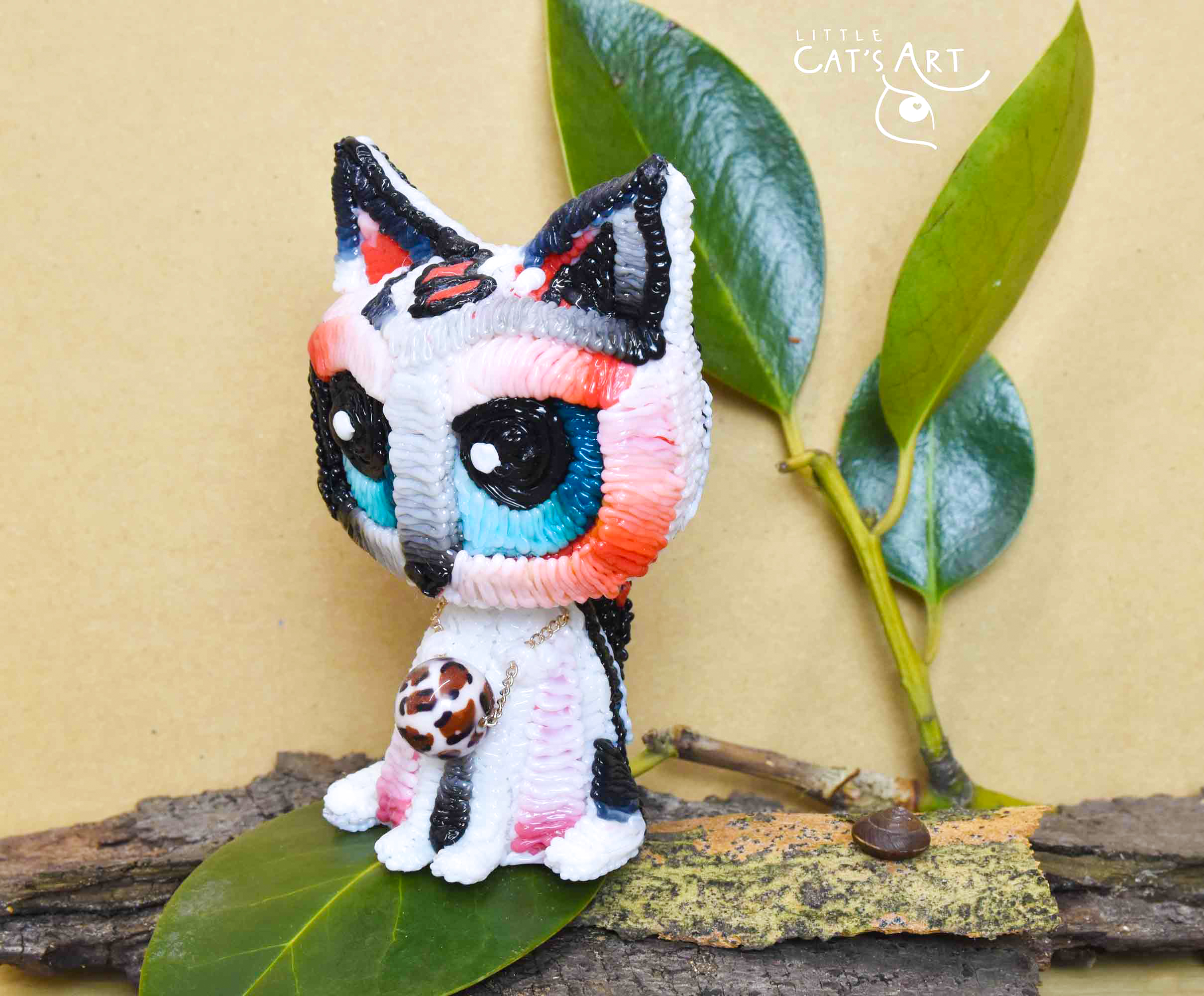 White leopard cat figurine with blue eyes