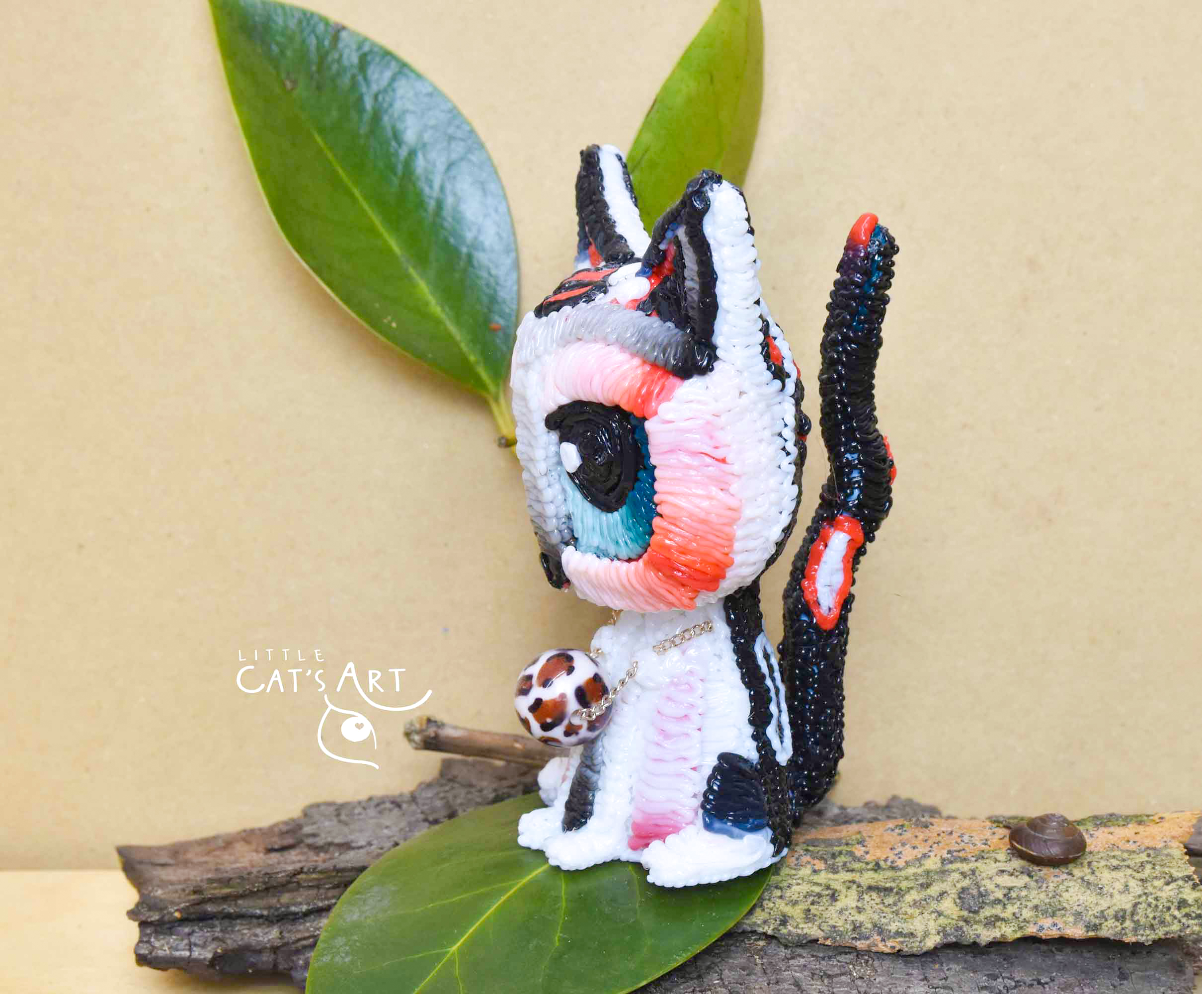 White leopard cat figurine with blue eyes