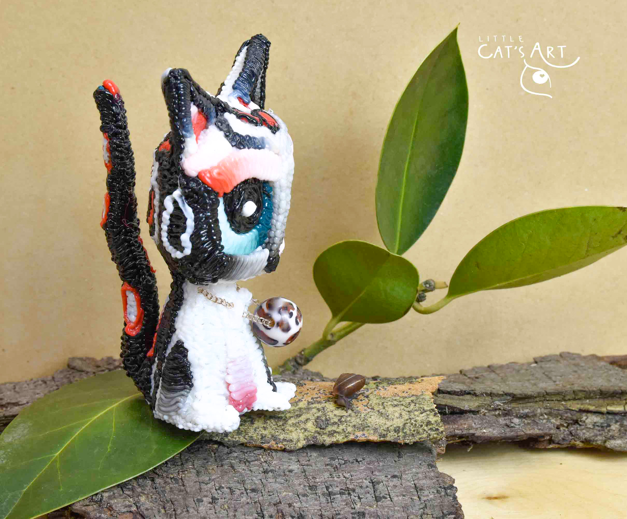 White leopard cat figurine with blue eyes