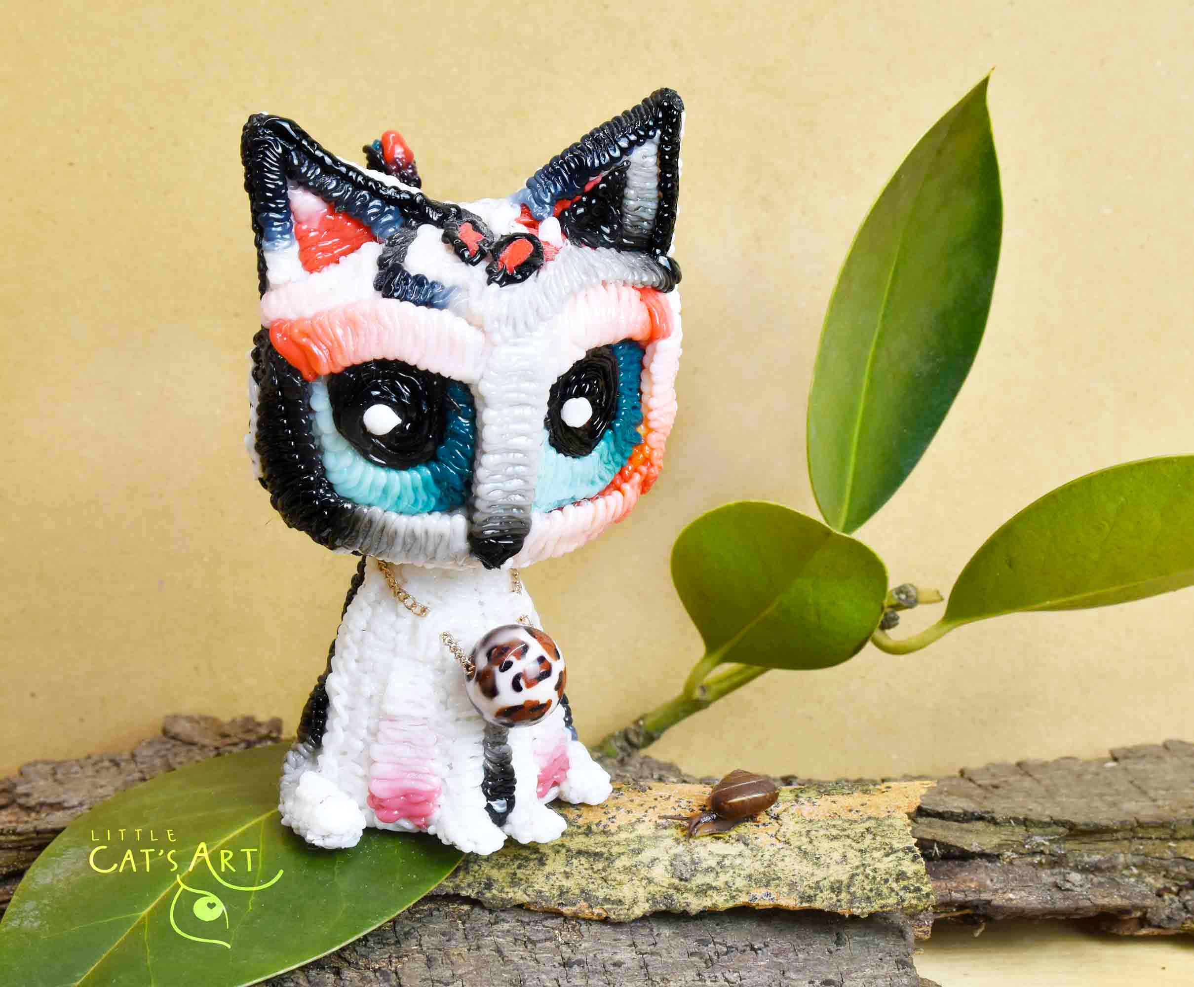 White leopard cat figurine with blue eyes