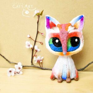 White rainbow cat figure