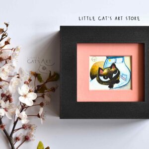 Siamese cat chilling on mom's neon blue jeans