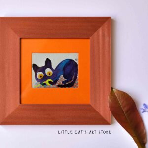 Tiny black cat playing with electric yellow yarn wall art