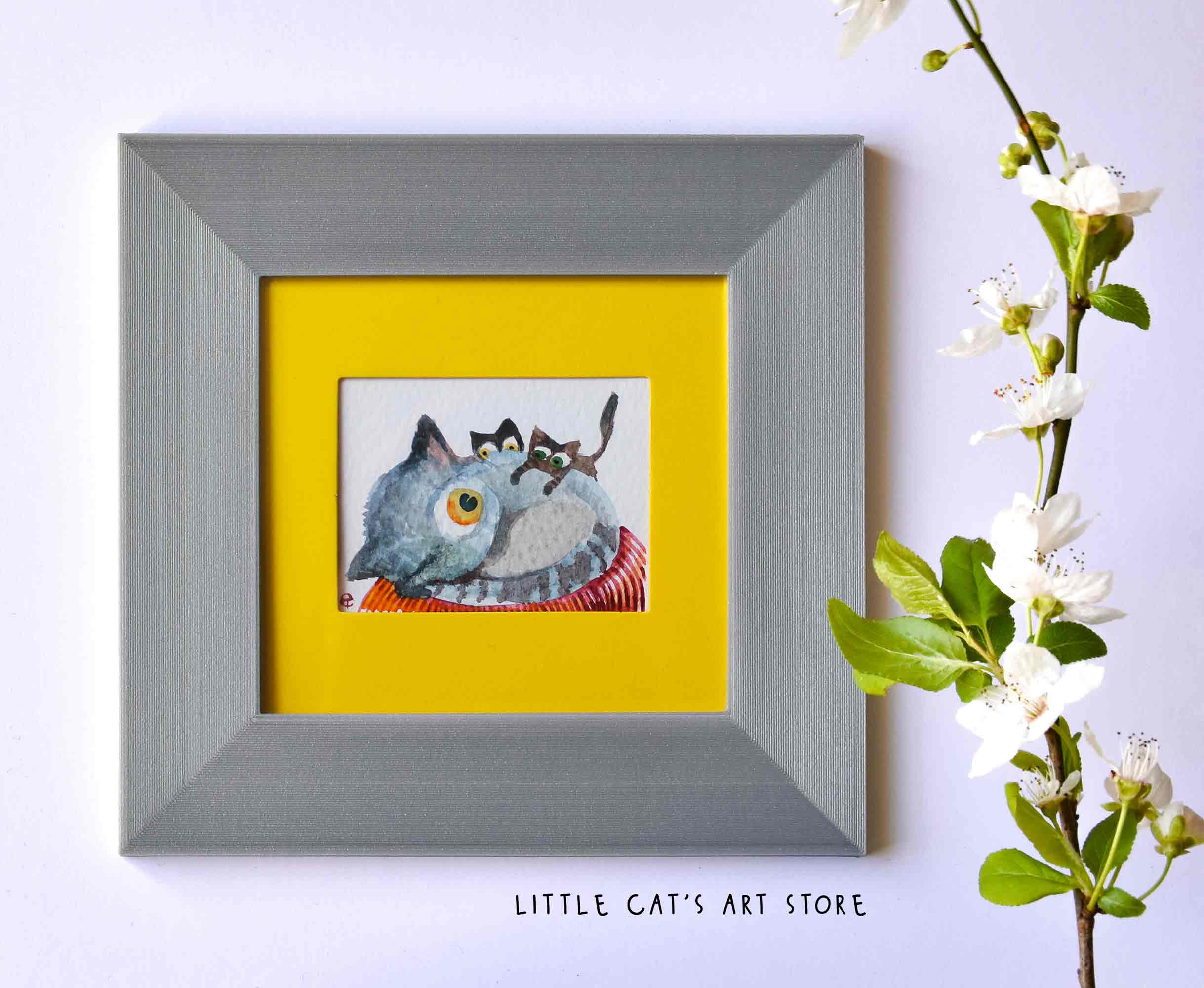 Watercolour painting depicts three cat family members