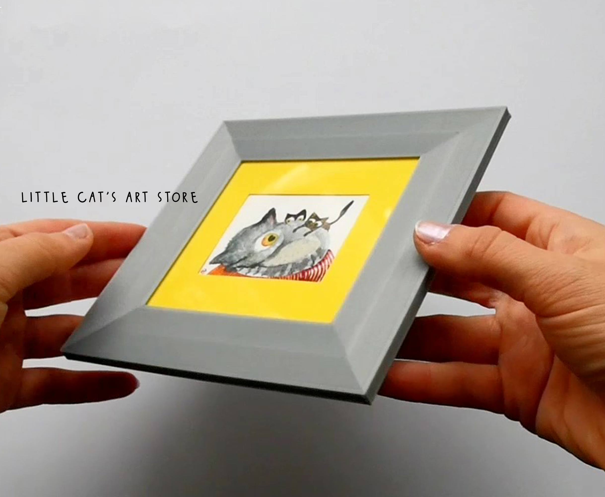 Watercolour painting held in hands