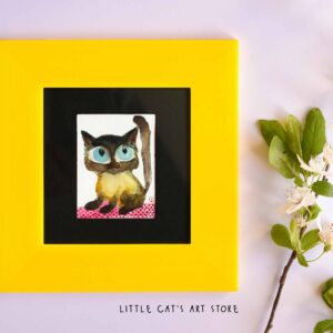 Black and yellow Siamese kitty portrait