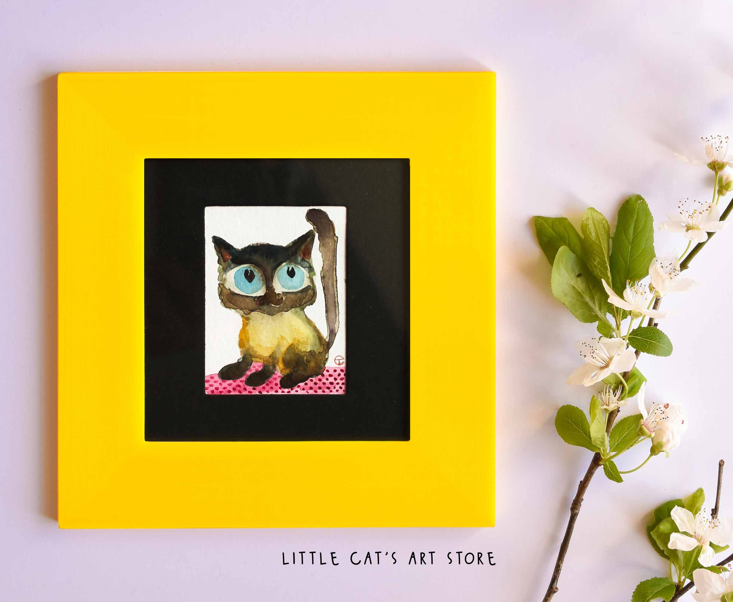 Black and yellow Siamese kitty portrait