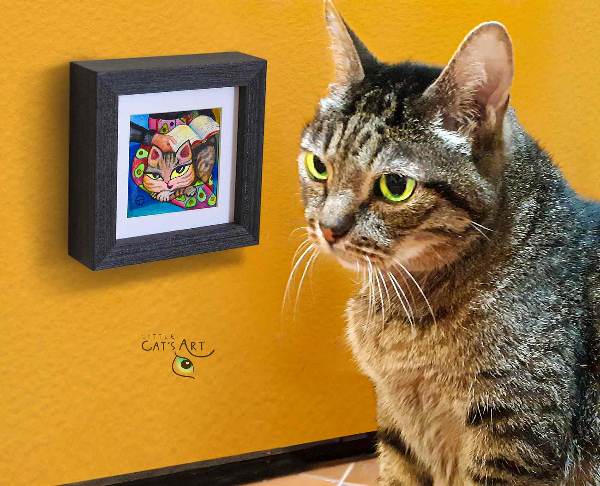 Miniature tabby cat painting and a real tabby cat