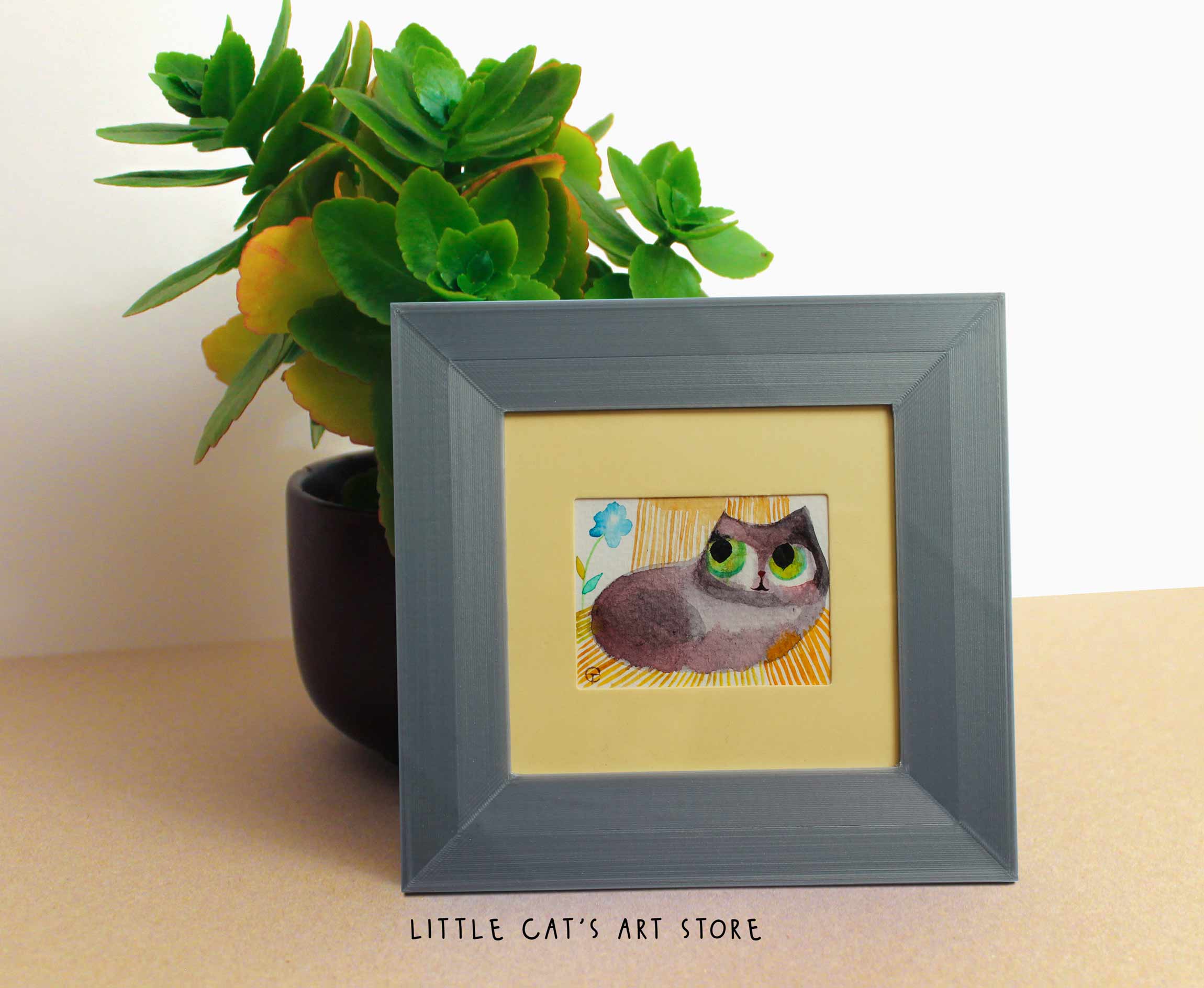 Rag Doll cat chilling on a garden deck chair painting