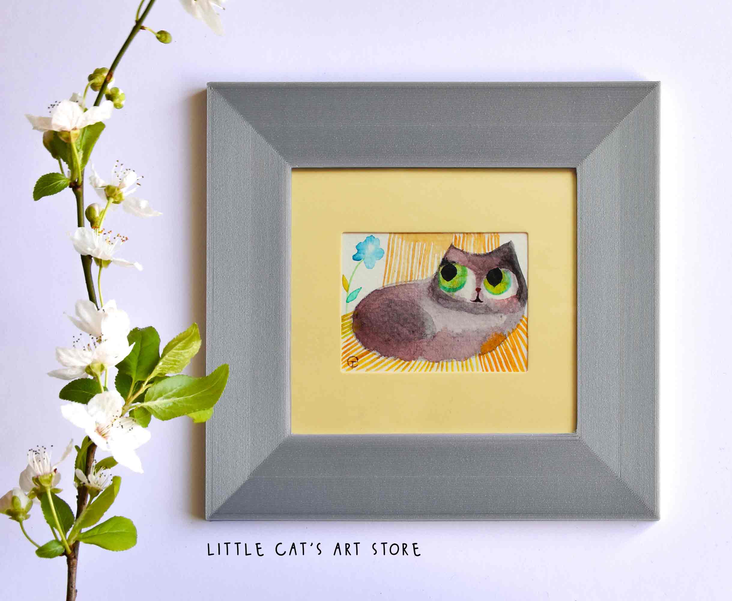 Rag Doll cat chilling on a garden deck chair painting