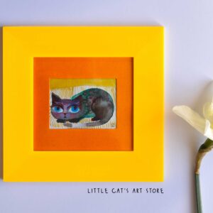 Lazy Tabby cat napping in golden-yellow bed