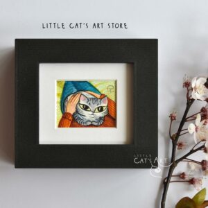 Grey tabby cat in owner's lap painting