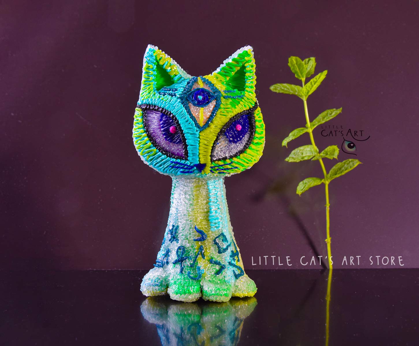 Green mint alien cat figurine with 3 eyes