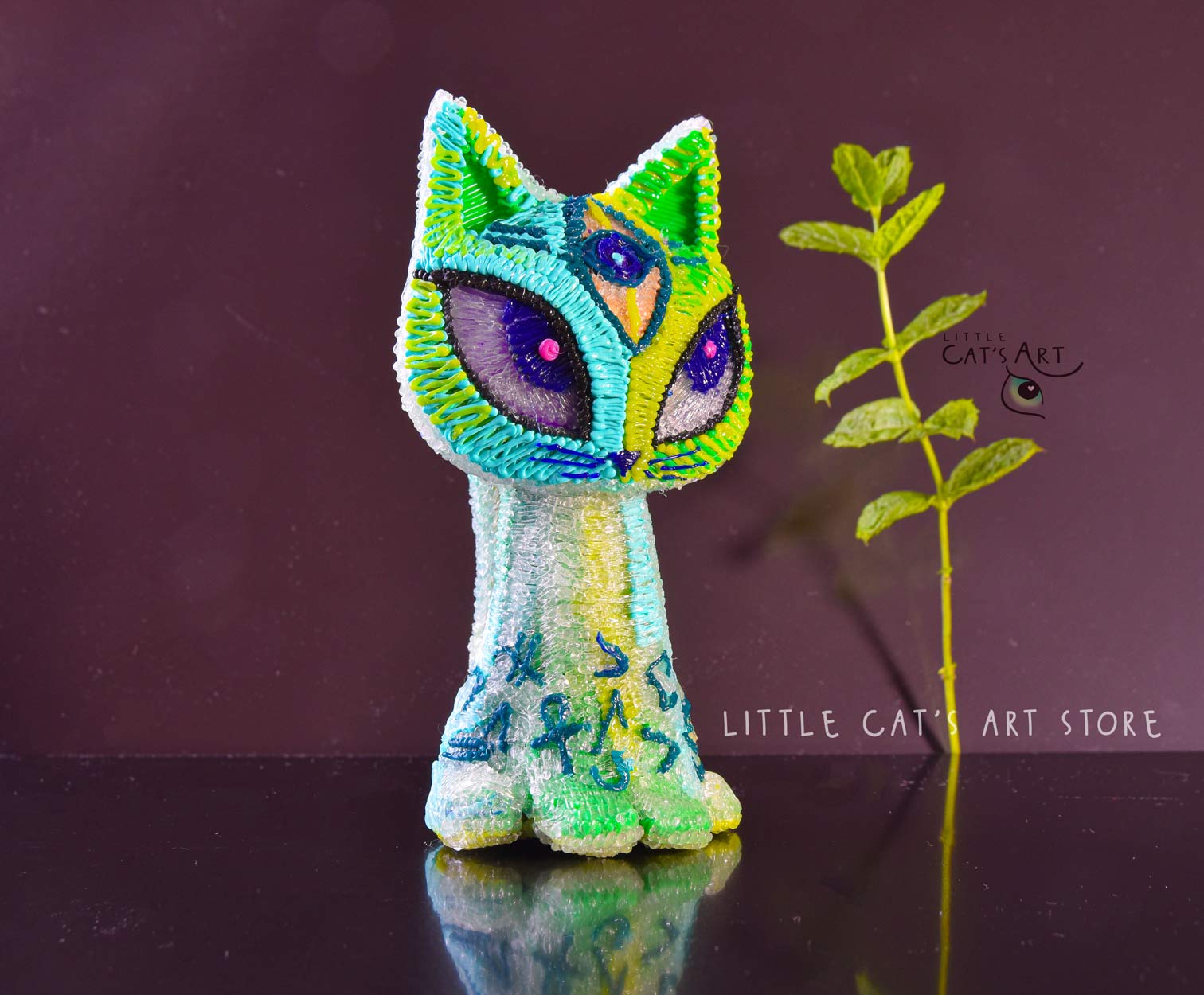 Green mint alien cat figurine with 3 eyes