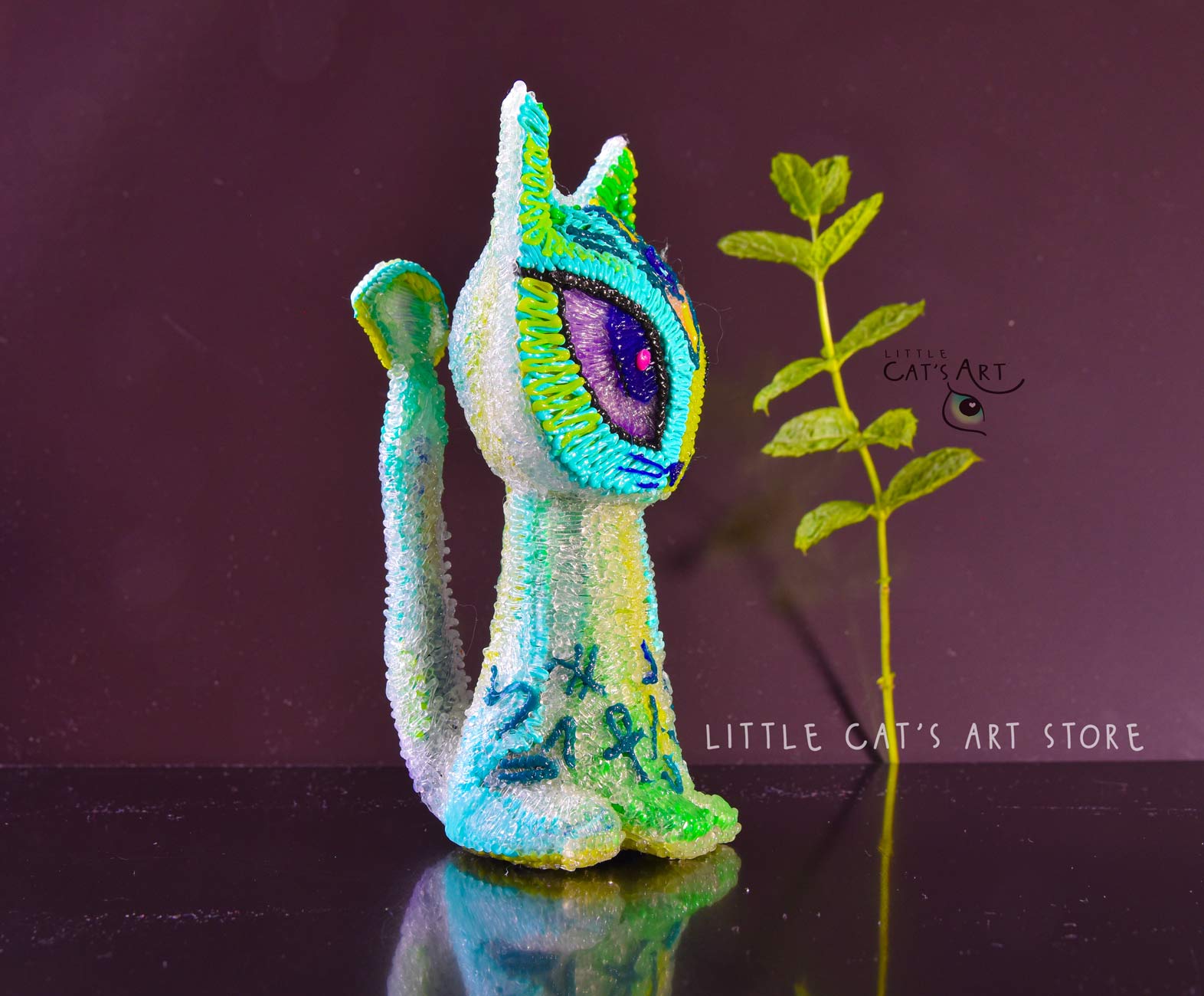 Green mint alien cat figurine with 3 eyes
