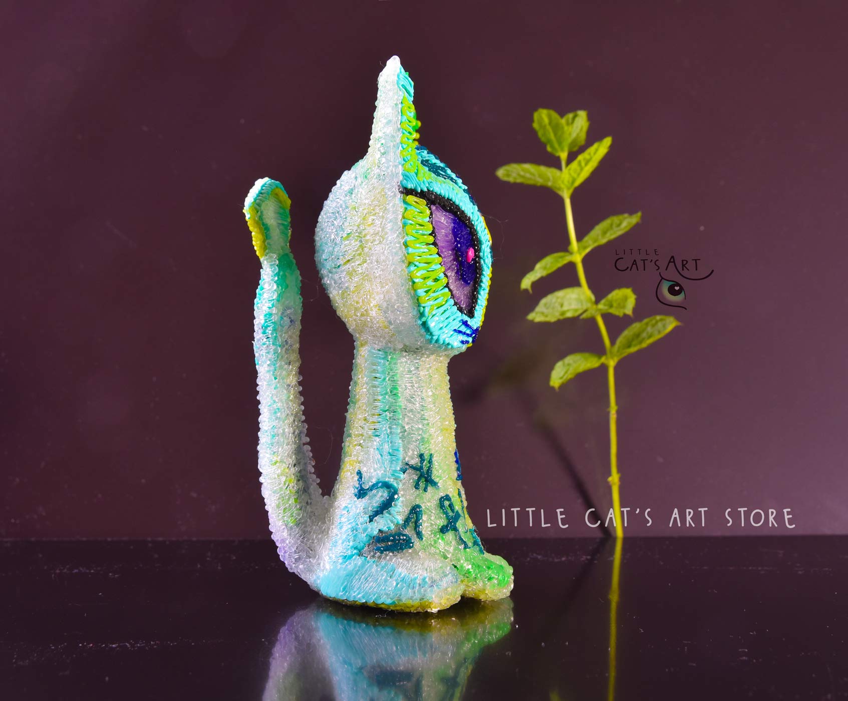 Green mint alien cat figurine with 3 eyes