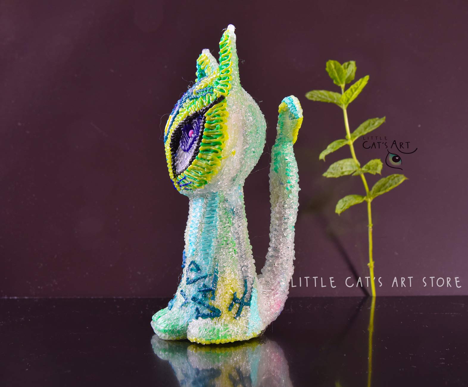 Green mint alien cat figurine with 3 eyes