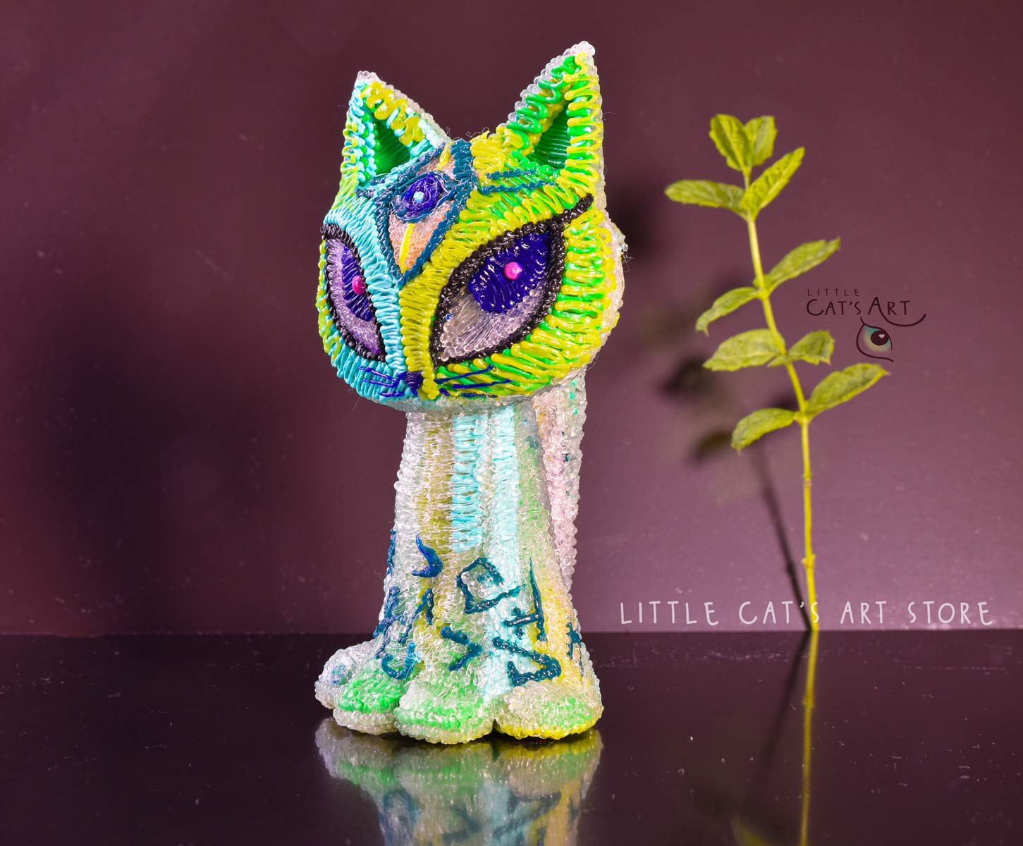 Green mint alien cat figurine with 3 eyes