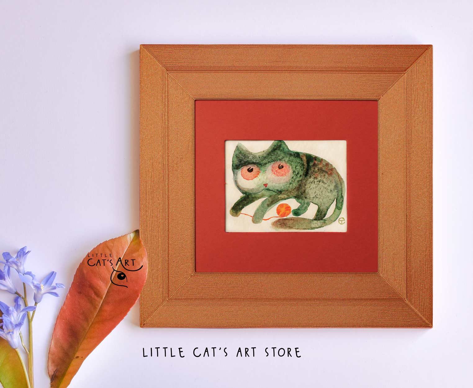 Green-brown kitty playing with orange yawn watercolour
