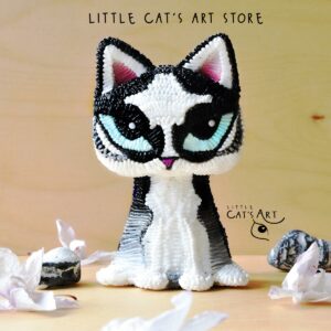 Husky cat figurine with bright blue eyes
