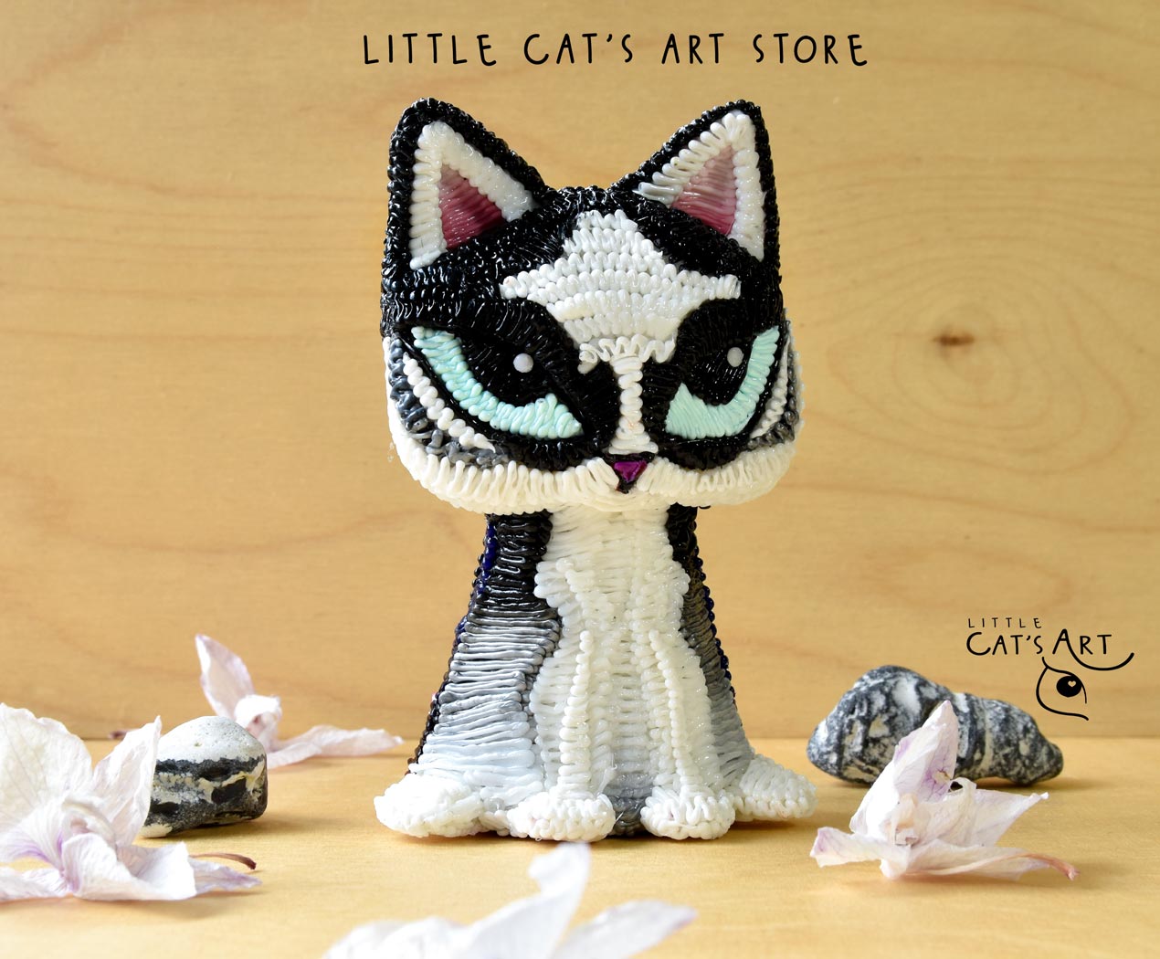Husky cat figurine with bright blue eyes