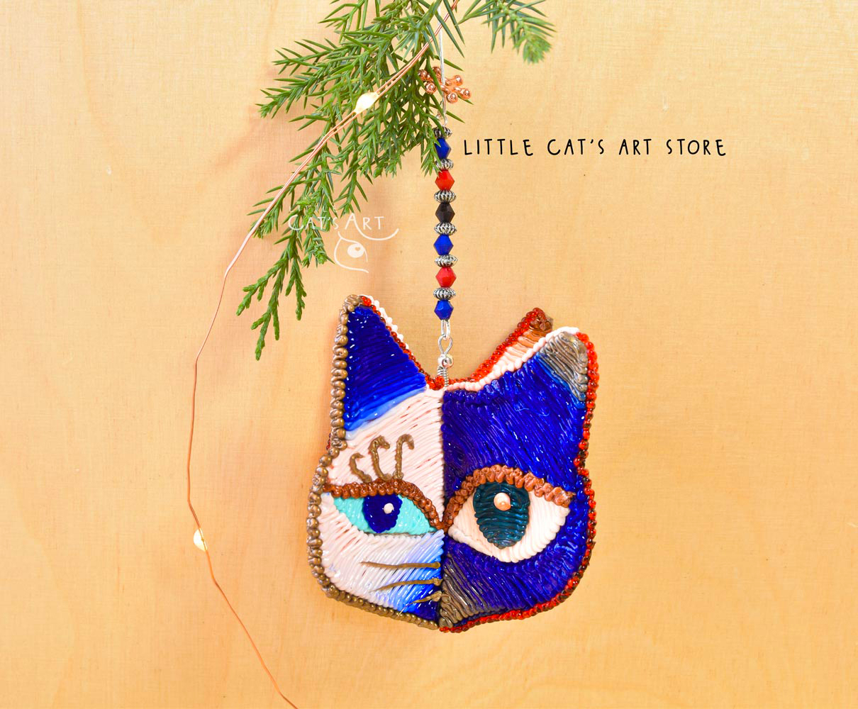 Day Night face winking cat ornament