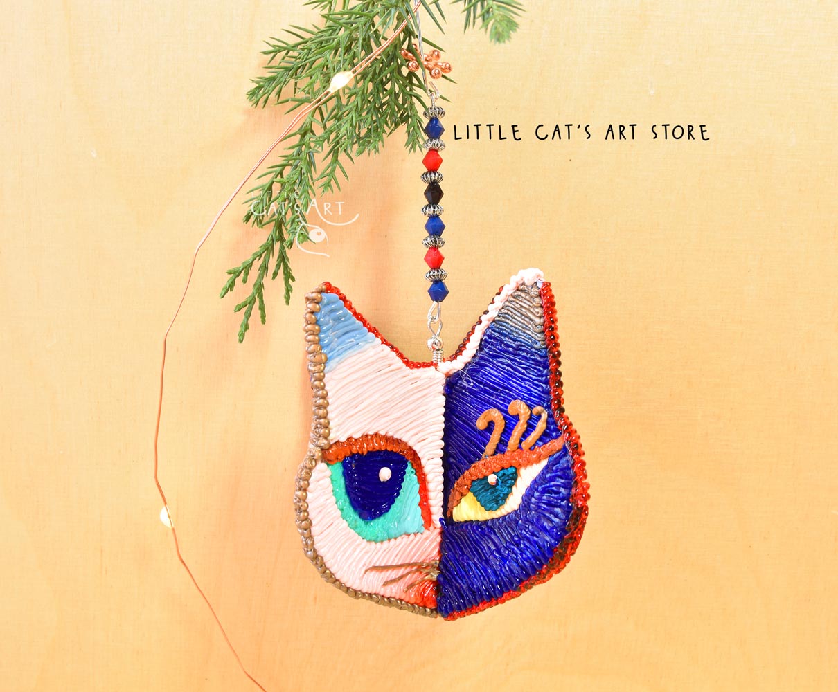 Day Night face winking cat ornament