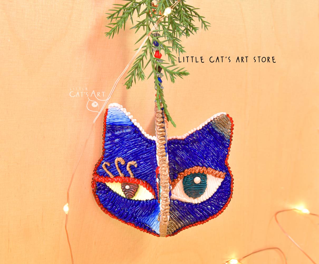 Night face winking cat ornament