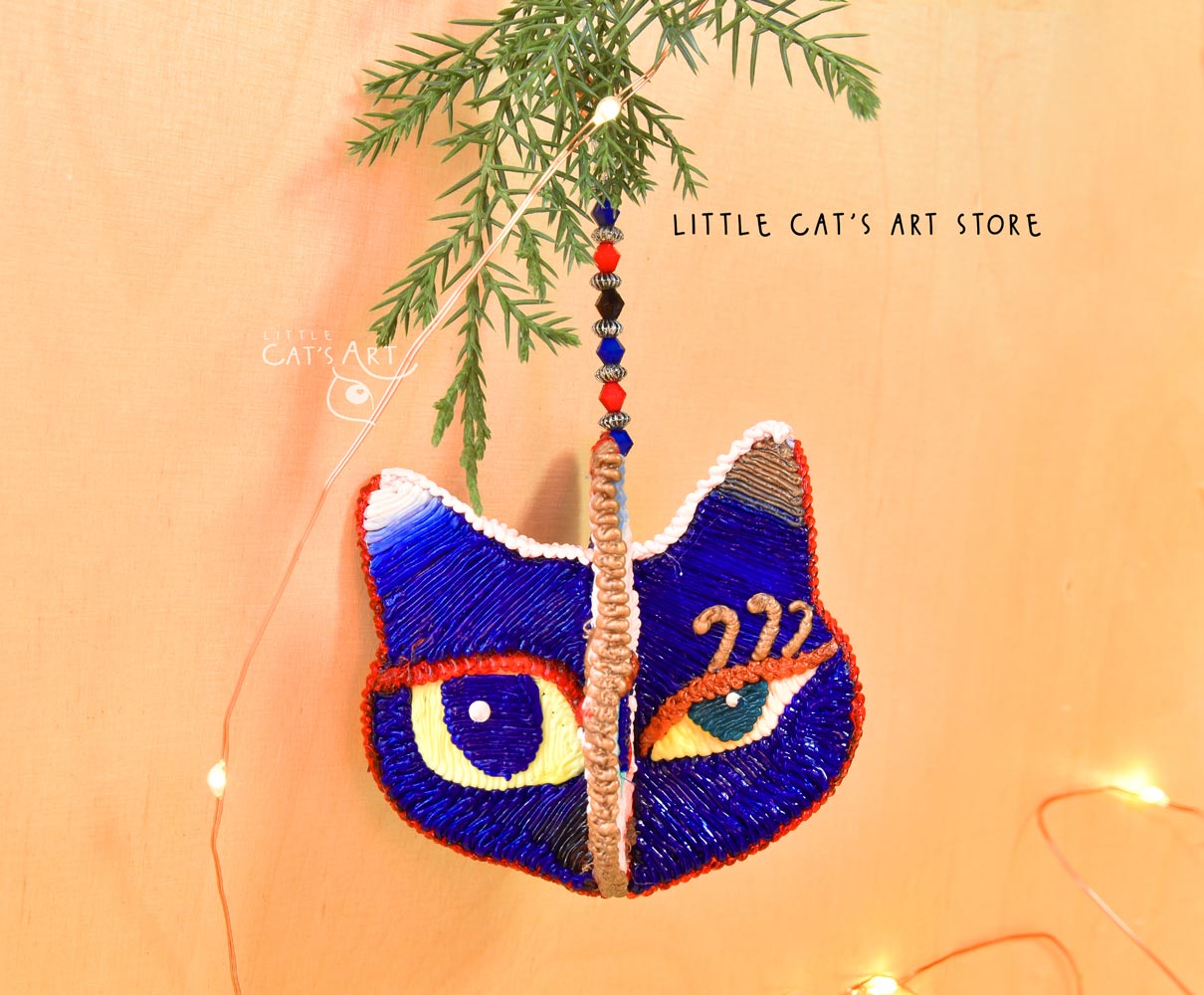 Night face winking cat ornament