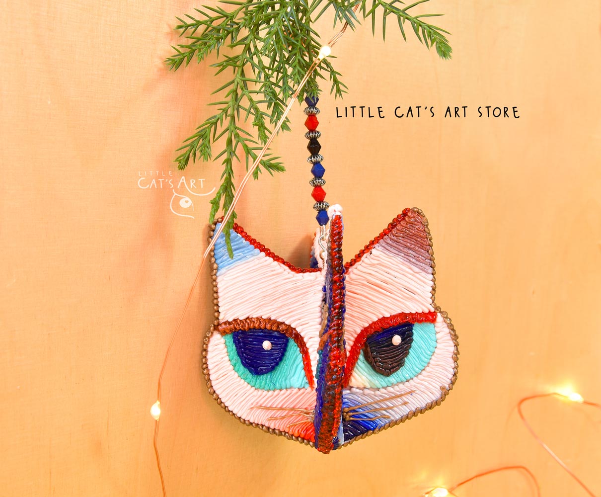 Day face winking cat ornament
