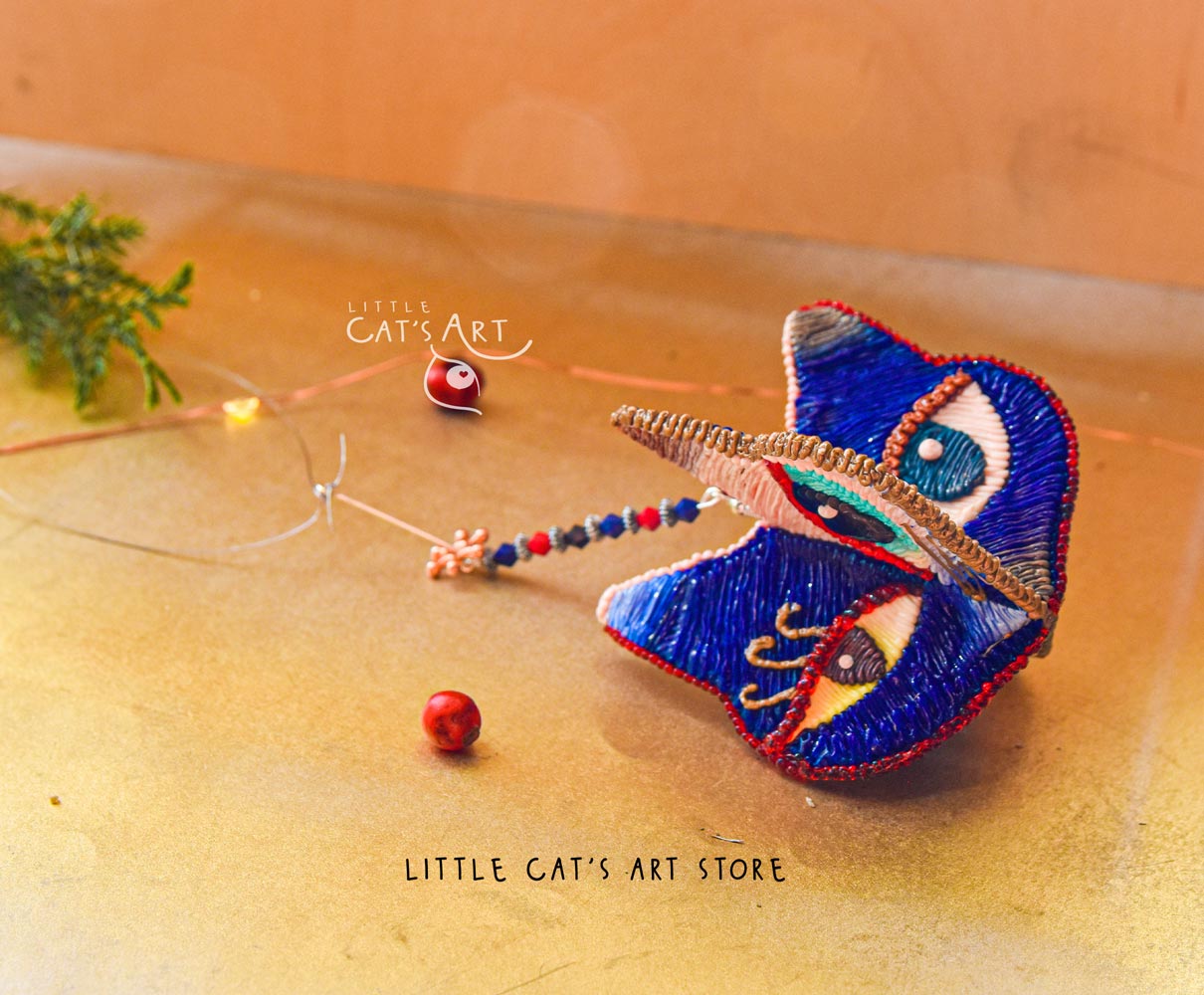 Day face winking cat ornament