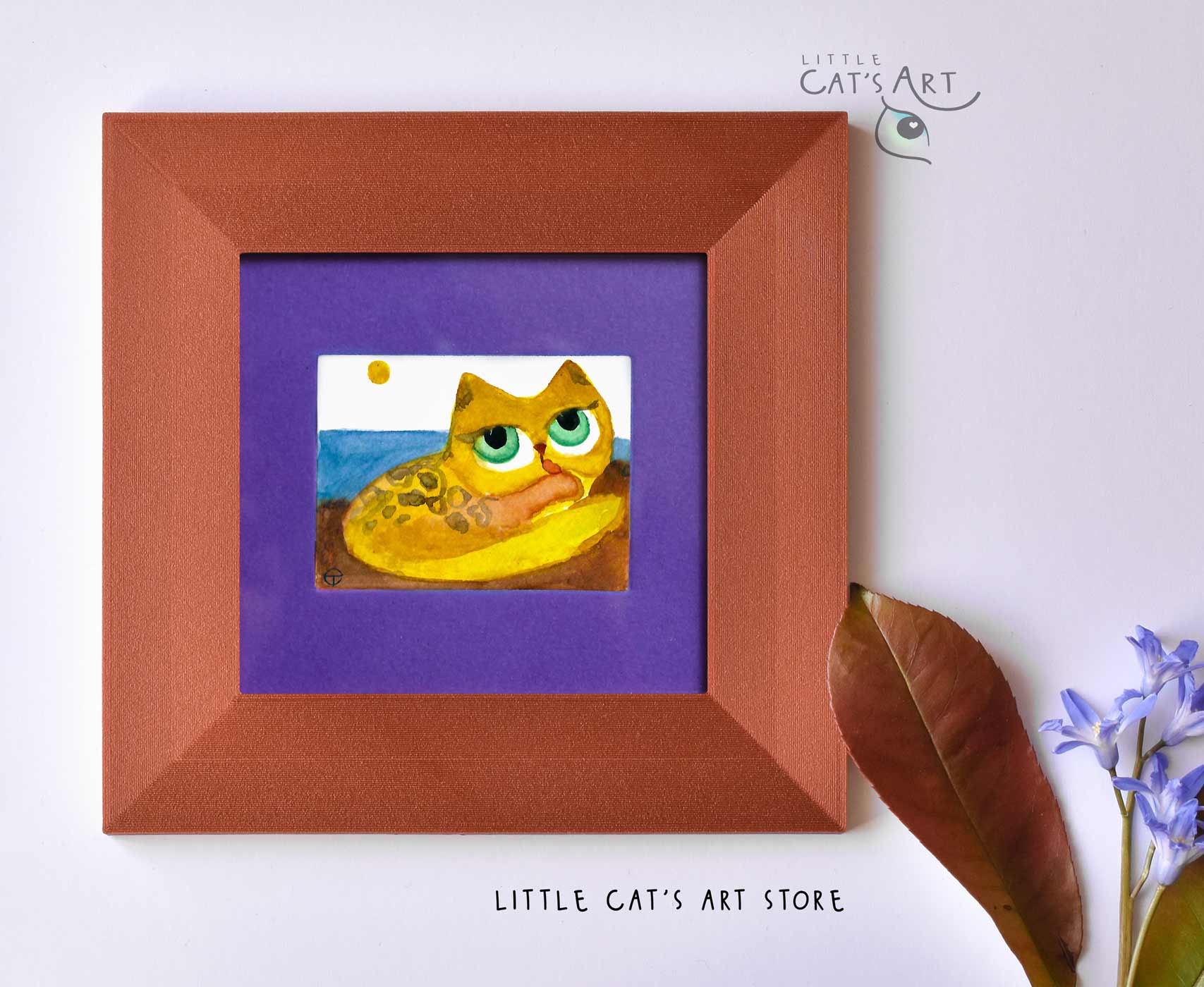 Yellow grooming feline on the beach