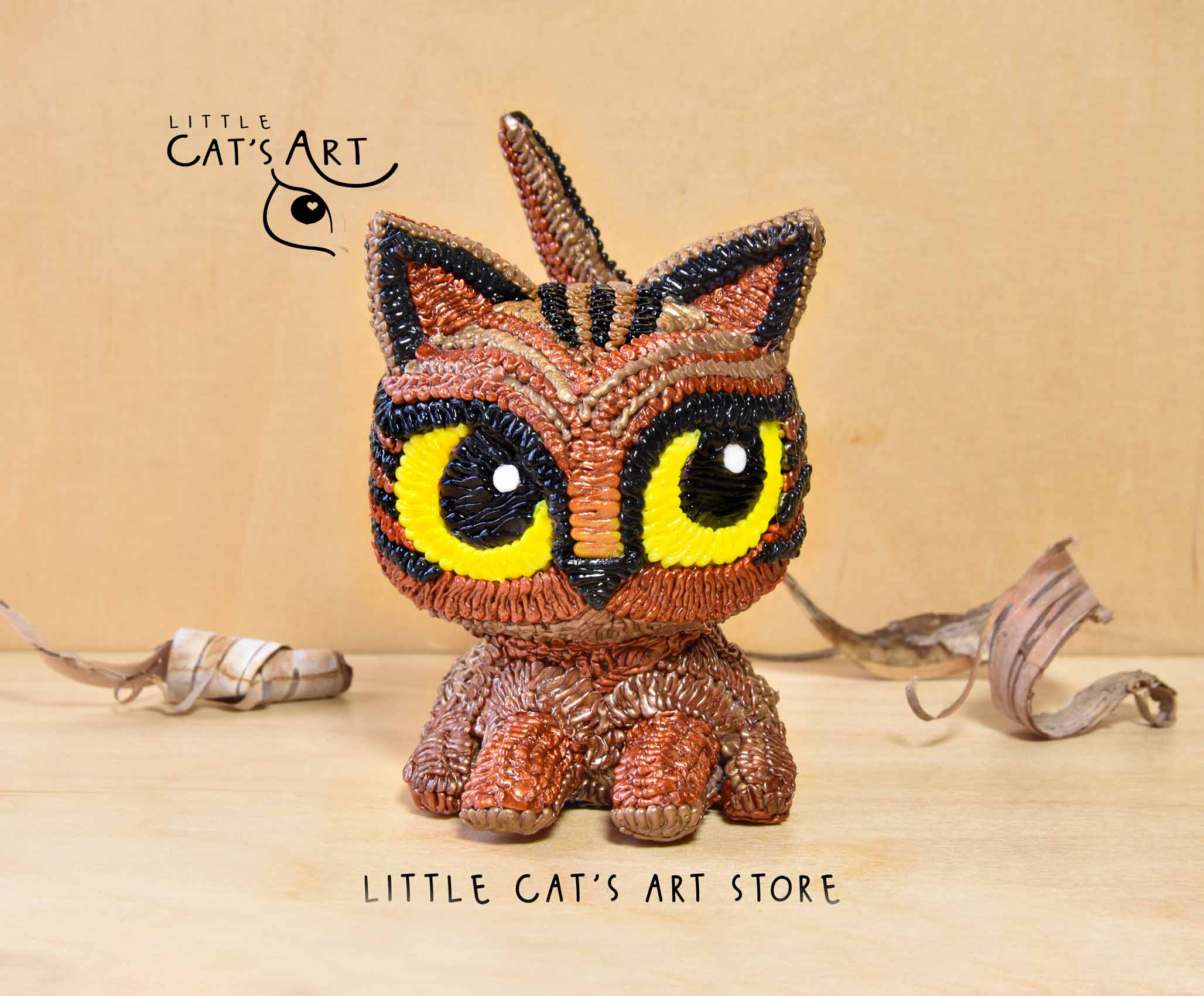 Tabby Copper cat figurine with yellow eyes and curly tail