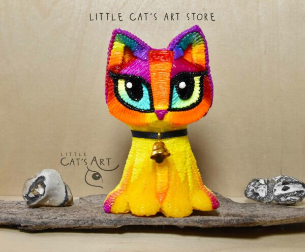 Rainbow and yellow cat figurine with little bell choker