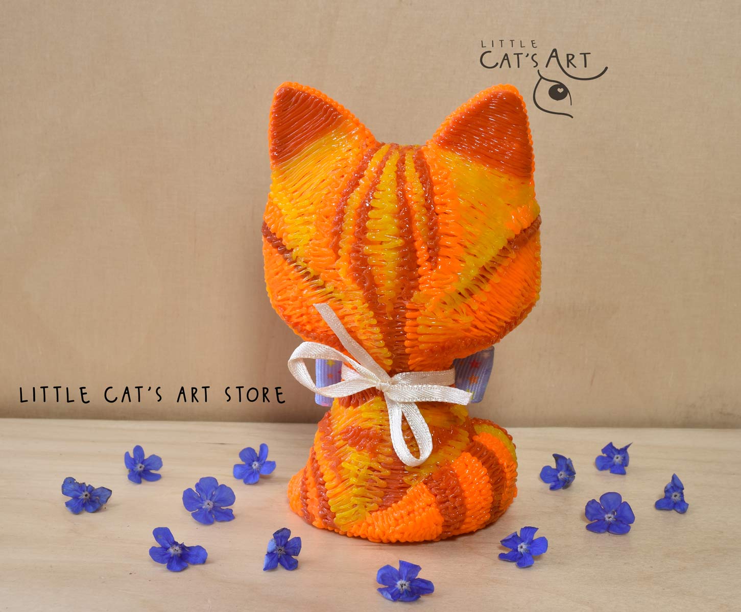 Ginger cat with green eyes wearing a bow tie