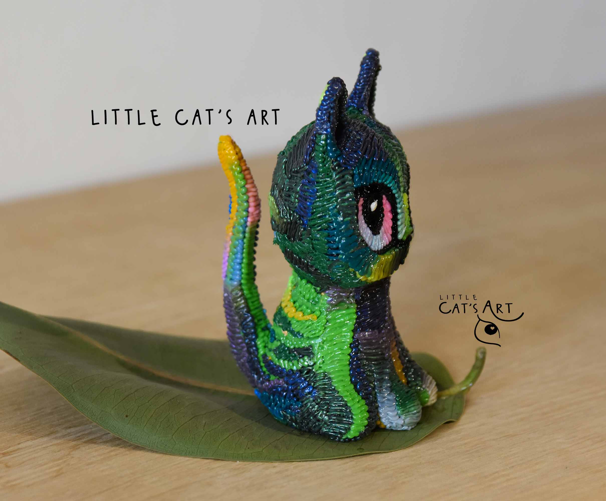 Iridescent green & purple cat figurine