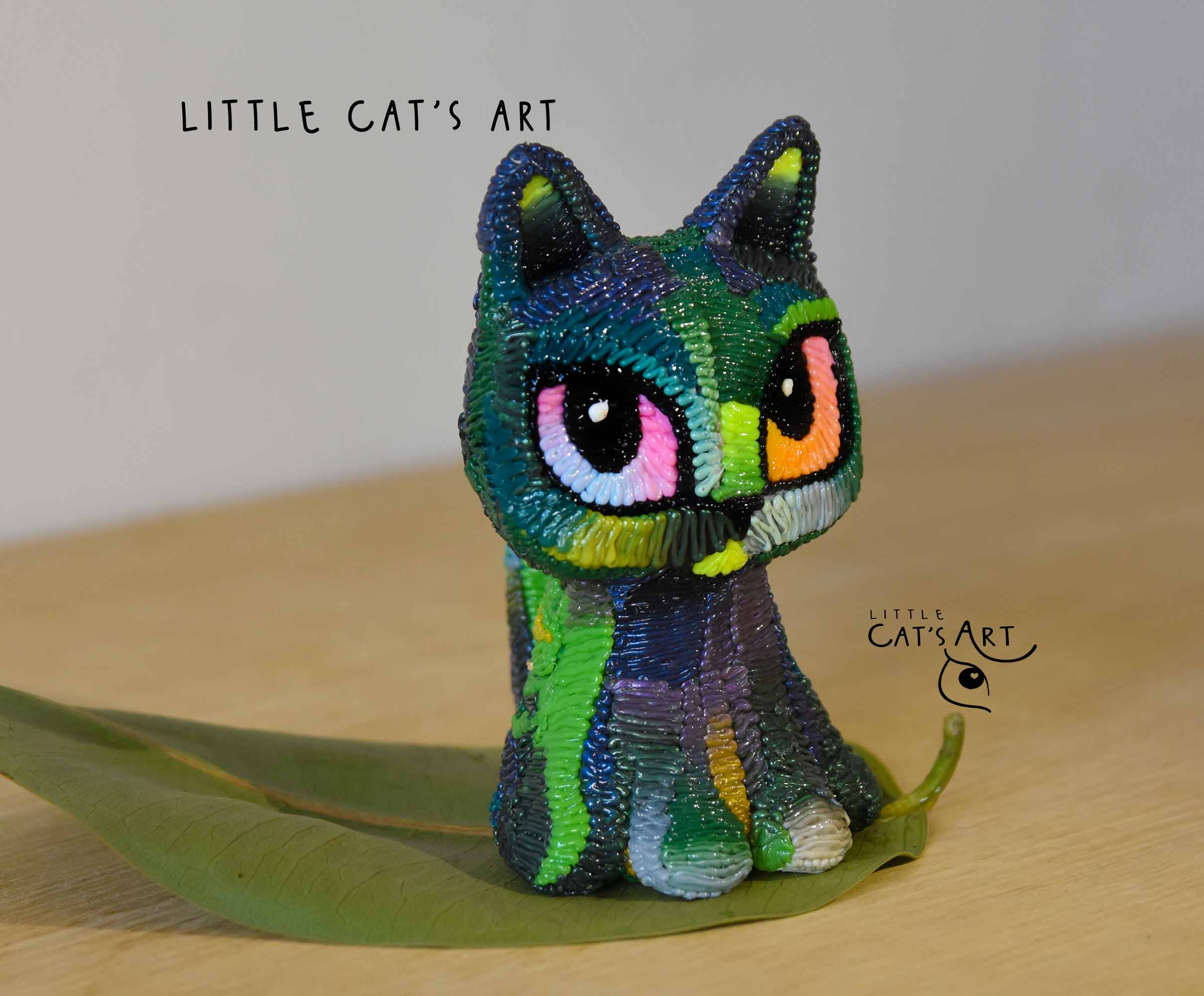 Iridescent green & purple cat figurine