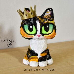 Mini me calico cat figurine wearing crown