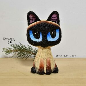 Siamese cat figurine with big blue eyes